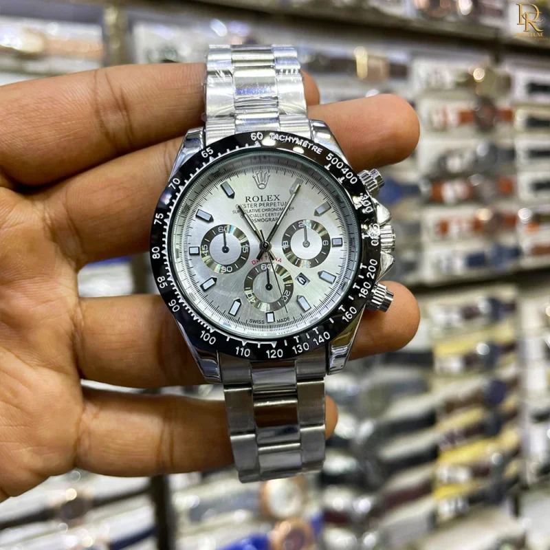 The ROLEX Daytona is a timeless classic designed for those who appreciate luxury and performance. Featuring a date-working dial and master lock, this second-copy model offers a bold, attractive look in fresh new colors — perfect for both casual outings and formal occasions. Key Features: ⌚ Date Working Dial – Stay on track with precision 🔒 Master Lock – Secure and comfortable fit 🎨 New Attractive Colours – Choose your perfect style 💯 Premium Finish – Smooth edges & detailed casing Care Instructions: Avoid exposure to strong magnetic fields and clean with a soft cloth. Why Choose This Product: Combines functionality with style, perfect for both casual and formal occasions. 💸 Price: PKR 3,500/- Only 📦 Includes Normal Box | Free Delivery & 7-Day Return Policy