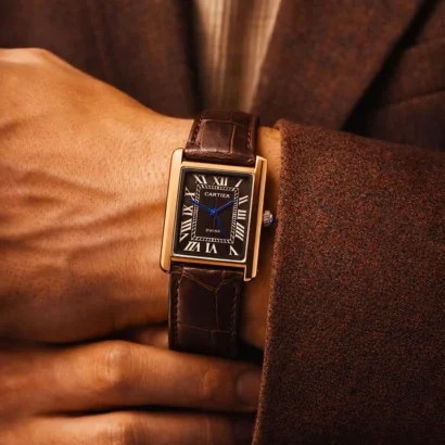 A Cartier Tank–style slim watch with leather strap and classic rectangular case — elegant design at an affordable price.