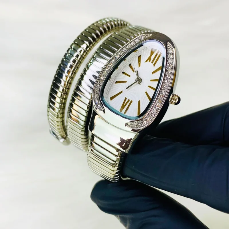 Home 3 6 A trendy snake-bracelet women’s watch with stone-studded case — stylish, lightweight, and designed for everyday fashion wear.