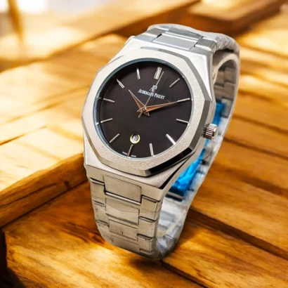 An Audemars Piguet–style men’s watch with stainless steel chain, butterfly lock, and working date — bold design at an affordable price.