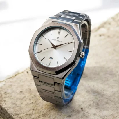 An Audemars Piguet–style men’s watch with stainless steel chain, butterfly lock, and working date — bold design at an affordable price.