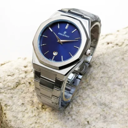 An Audemars Piguet–style men’s watch with stainless steel chain, butterfly lock, and working date — bold design at an affordable price.