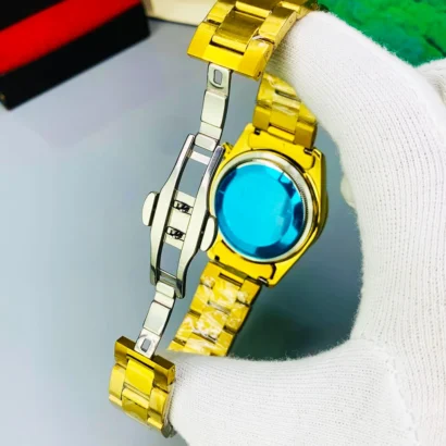 A Rolex-style rainbow stone watch with working date, butterfly lock, and bold luxury look — made for shine, not Swiss horology.