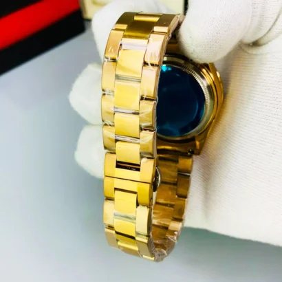 A Rolex-style rainbow stone watch with working date, butterfly lock, and bold luxury look — made for shine, not Swiss horology.
