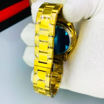 A Rolex-style rainbow stone watch with working date, butterfly lock, and bold luxury look — made for shine, not Swiss horology.